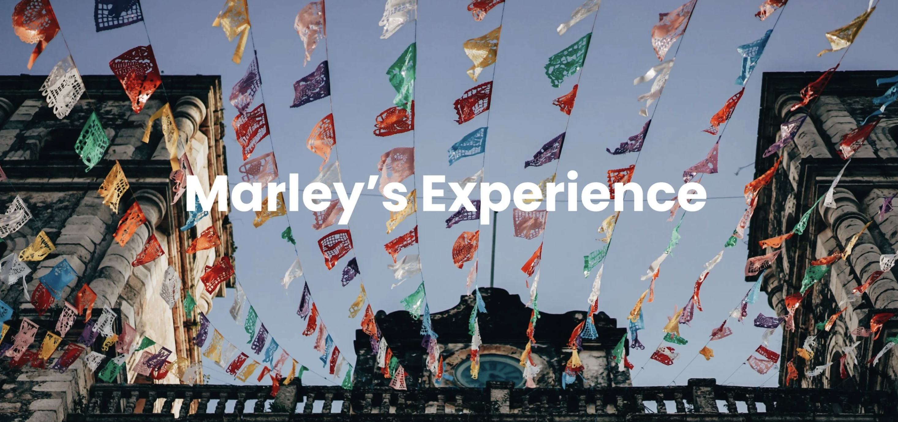 Marley's Experience section title over colorful papel picado flags in Mexico